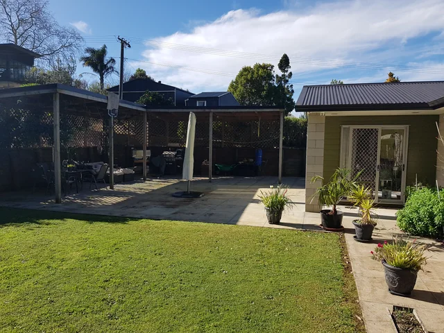 Covered patio and lawn · owner photo, July 2023