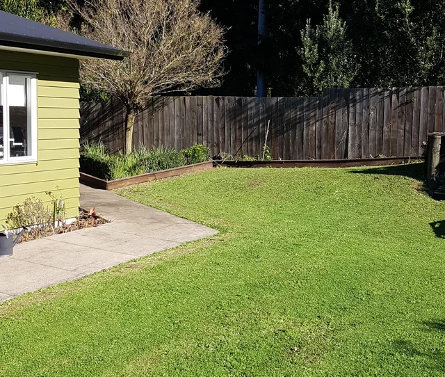 Lawn and garden beside the house · owner photo, June 2023